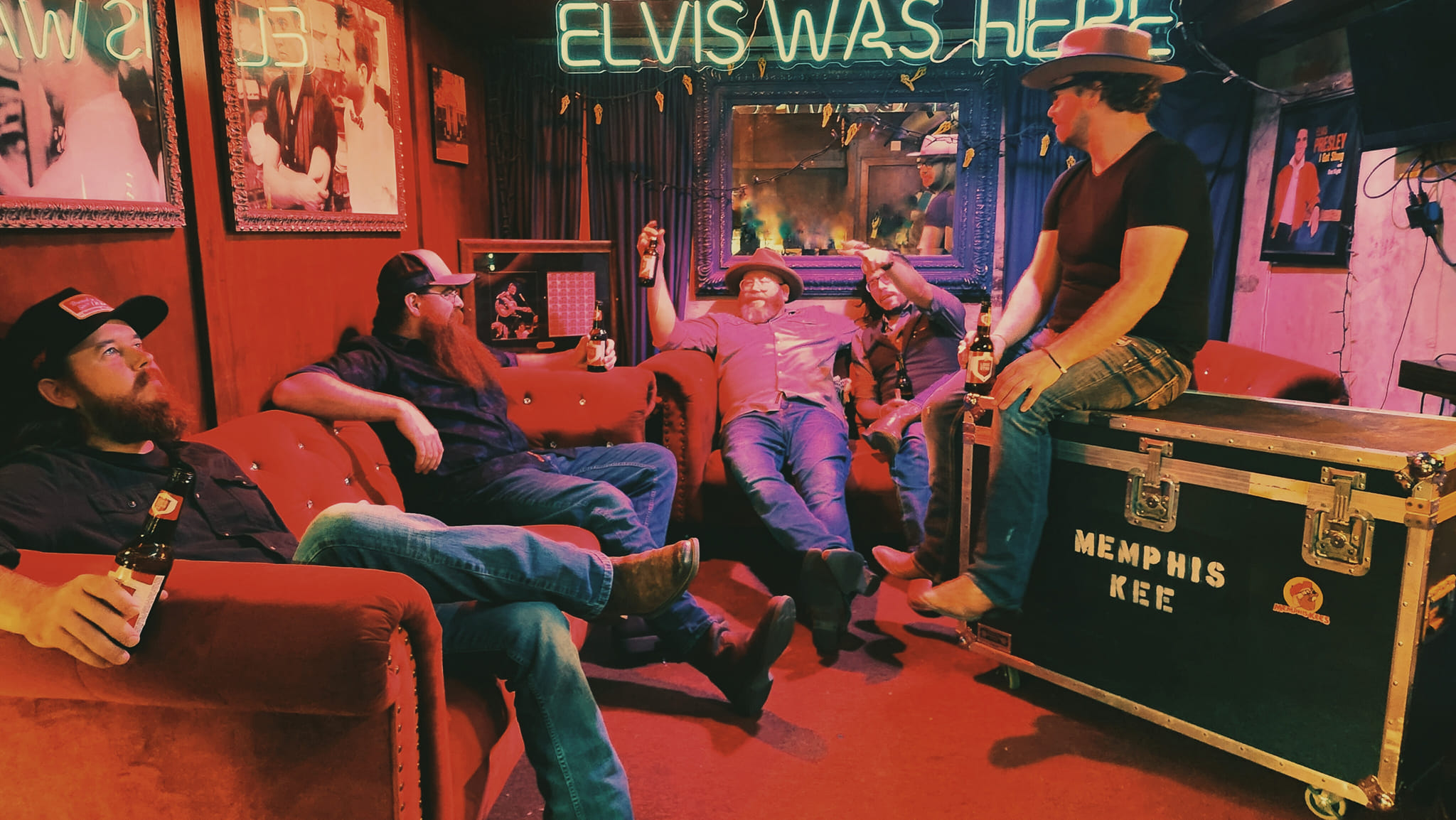 The band hanging out in the Elvis room at Hernandos Hideaway