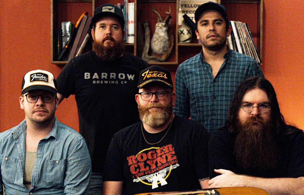 Band Standing Behind Table At Yellowdog Studio